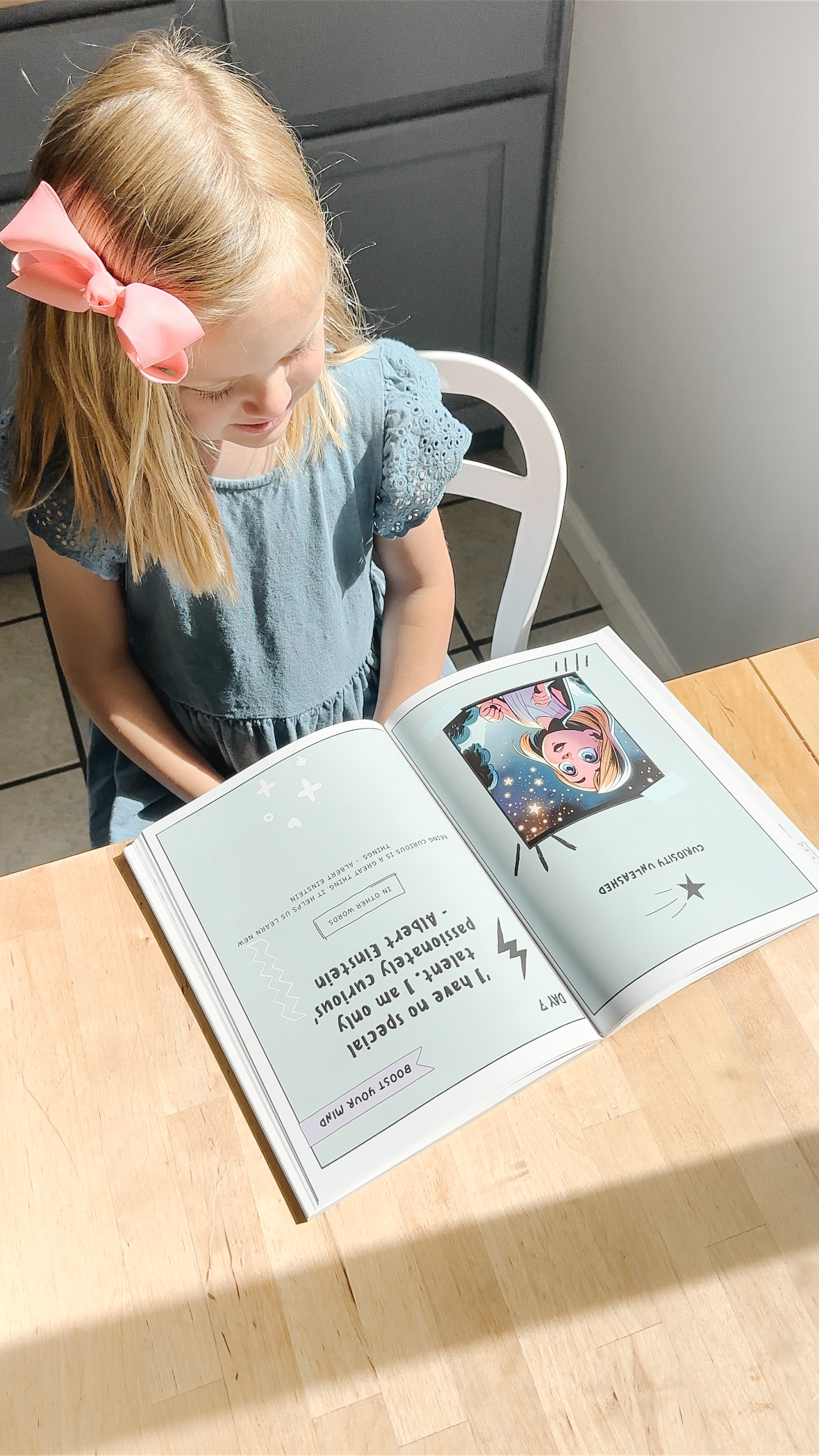 Girl reading curiosity page with Einstein quote