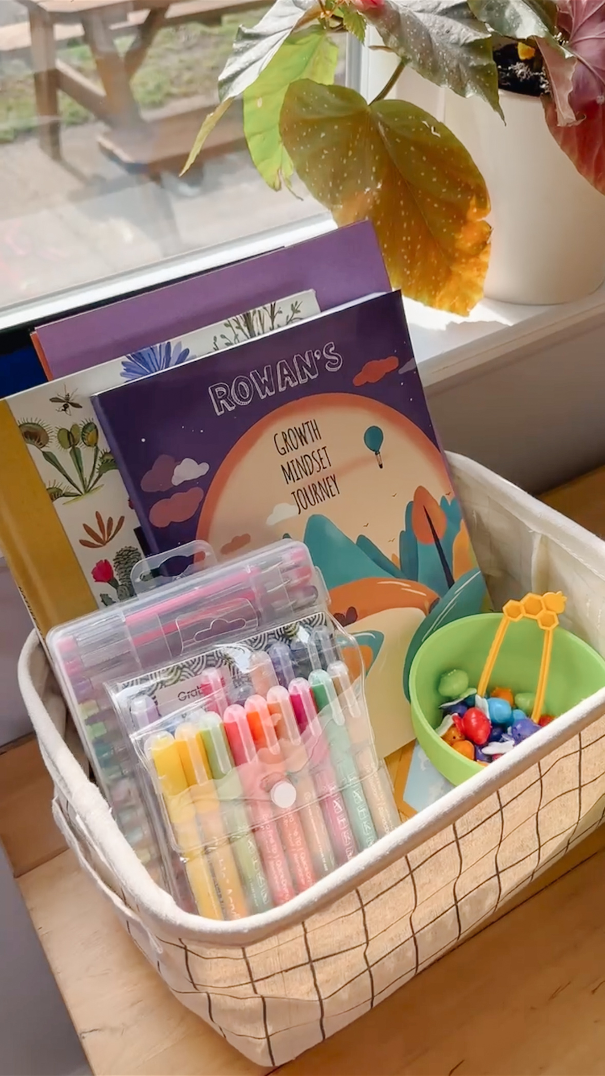 Gift basket with personalized book, markers, and beads